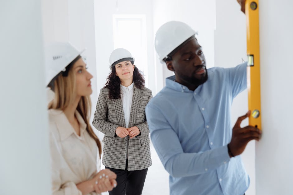 Friendly construction contractor inspecting home exterior